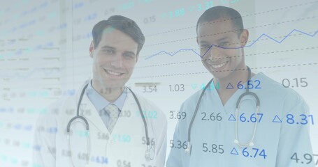 Analyzing line chart overlay, two medics standing in clinic, stethoscopes, lab coat and scrubs