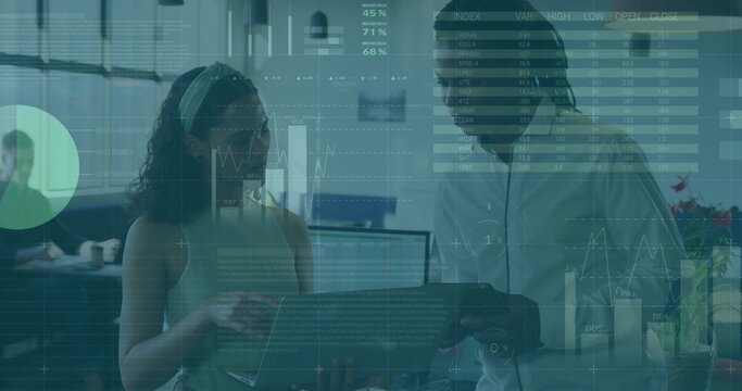 Analyzing laptop coworkers wearing sleeveless top, button-up shirt at office, with data overlays