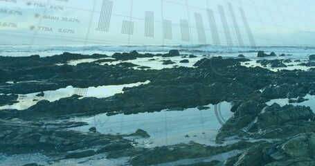 Displaying jagged rock formations with tide pools and waves on shore, with digital charts overlay