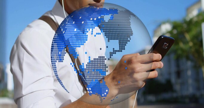Man wearing white shirt earphones and bag checking smartphone on sunlit sidewalk with globe overlay
