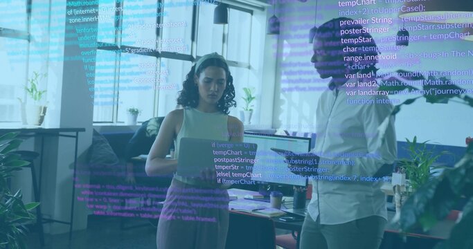 Collaborating colleagues coding on laptop and tablet in modern office, with floating code lines - Powered by Adobe