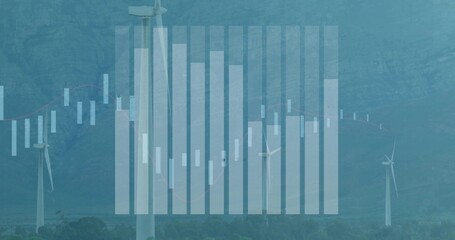 Towering white wind turbine rising in mountain valley, with financial charts overlay, copy space
