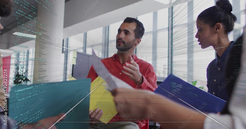Aufkleber gesturing red-shirted man discussing project at open office, with colored folders and code overlay