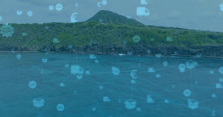 Displaying volcanic island peak rising over coastal turquoise sea, featuring digital overlay icons