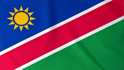 Fototapeta premium Namibia’s blue-red-green flag with radiant sun and diagonal white borders—symbolizing ocean, heroism, vegetation, and peace.