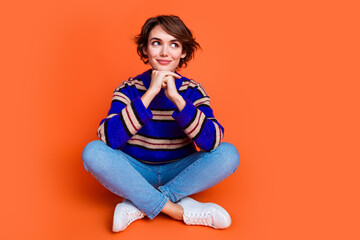 Photo portrait of young brown hair lady in blue striped cute sweater sitting floor dreaming looking...