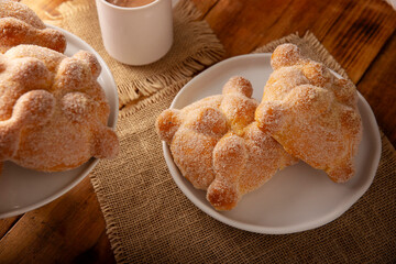 Pan de Muerto. Traditional Mexican sweet bread that is consumed in the season of the day of the dead. It is a main element in the altars and offerings in the festivity of Dia de Muertos in Mexico.