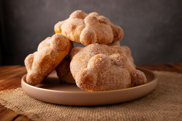 Pan de Muerto. Traditional Mexican sweet bread that is consumed in the season of the day of the dead. It is a main element in the altars and offerings in the festivity of Dia de Muertos in Mexico.