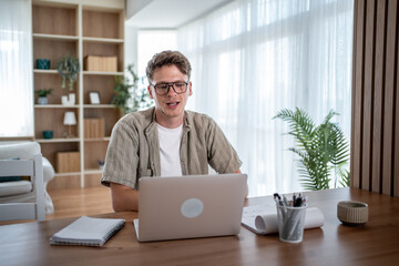 Freelancer working from home having video call on laptop