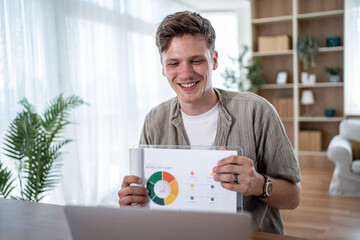 Manager showing charts during online meeting at home