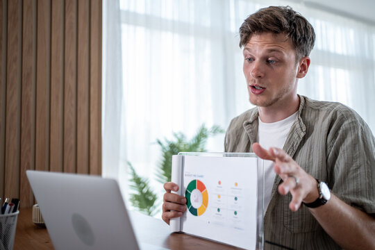 Businessman presenting charts and graphs on video call using laptop - Powered by Adobe