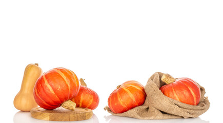 Ripe sweet pumpkins isolated on white background, close-up.
