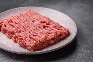 Raw ground beef or pork, fresh meat for burgers or other dishes. Raw beef minced meat