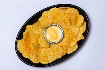 Top view studio shot photo of Nachos with Cheese Dip