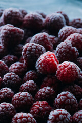 frozen raspberries ice background