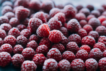 frozen raspberries ice background