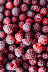 frozen raspberries ice background