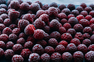 frozen raspberries ice background