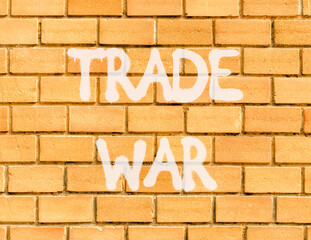 Trade war symbol. Concept word Trade war on beautiful brown brick wall. Beautiful brown brick wall...