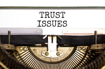 Trust issues symbol. Concept word Trust issues typed on beautiful old retro typewriter. Beautiful...