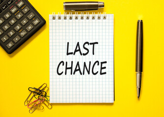 Last chance symbol. Concept word Last chance on beautiful white note. Black calculator. Black pen....
