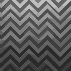 Abstract gray chevron pattern with a dark gray background. Geometric design with a modern, minimalist aesthetic.