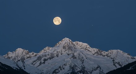 Full moon over snowy mountains