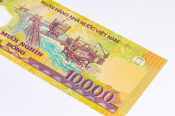 10000 Dong Vietnam with the image of offshore oil platforms PetroVietnam. Polymer money of Vietnam.