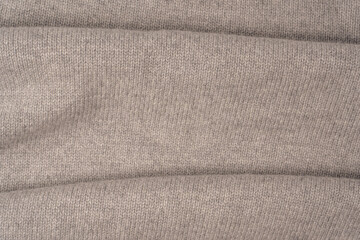 Soft grey merino wool sweater texture as a background.