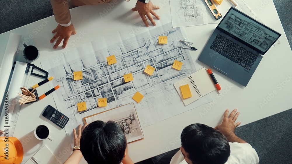 Aufkleber top down aerial view of smart architect engineer team pointing and discussing about building constru