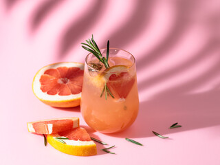 Summer drink with grapefruit, rosemary, and ice.