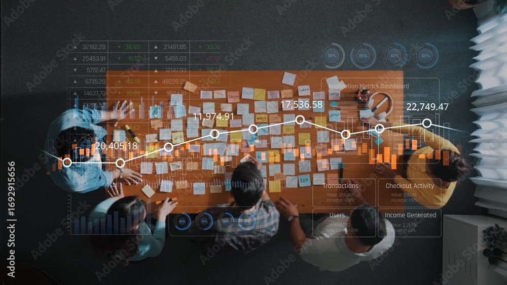 Poster a business team collaborates at a table filled with sticky notes and charts, analyzing data trends t