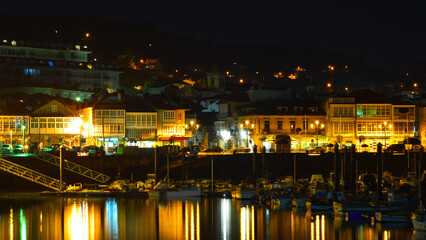 Night in Baiona on the Way of St James. Reflections in the harbour. 