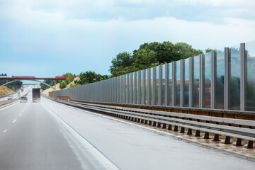 Noise Wall on Road. Sound Wall or Noise Barrier. Modern Highway and Roadside Barriers. Traffic...