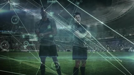 Lights igniting field, two teammates shifting stance while data nodes forming for soccer analytics - Powered by Adobe