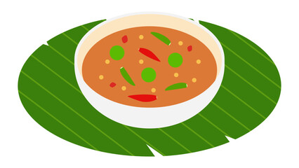 Thai shrimp paste chili dip (nam prik kapi) in a bowl on banana leaf