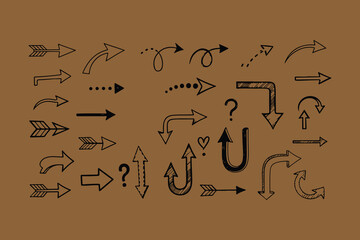 Collection of hand drawn arrows and question marks on brown background