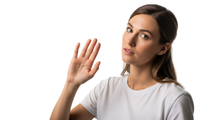Young woman waving hand saying hello and greeting with friendly expression isolated on black background