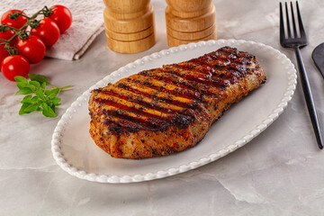 Grilled pork steak with bone