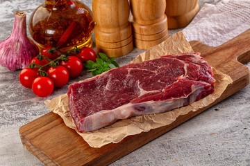 Gourmet raw rib eye steak