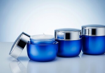 Blue Cosmetic Cream Jars with Open Lid and White Cream