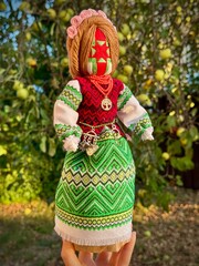Beautiful elegant ,handmade dolls on background, magical Slavic wish doll