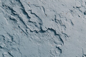 Fototapeta premium Textured blue wall with cracks