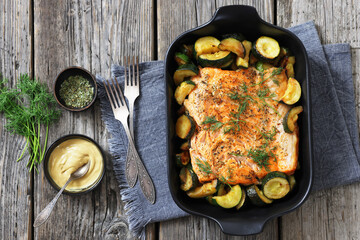 freshly baked salmon fillet with zucchini and dill