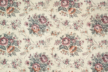 Seamless old-fashioned floral repeated pattern on a tapestry fabric texture biege background. Old retro fashion