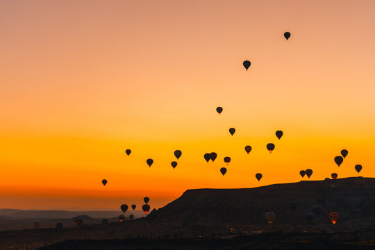 Colorful hot air balloon flying over Cappadocia, Turkey.