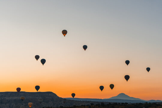 Colorful hot air balloon flying over Cappadocia, Turkey.