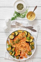 freshly baked salmon fillet with zucchini and dill