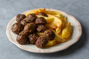 Meatballs and potatoes are delicious. Turkish name; kofte ve patates kizartmasi