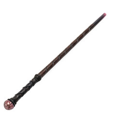 Naklejka premium A detailed view of a dark brown wizard wand with a red gem at the end, isolated on transparent background